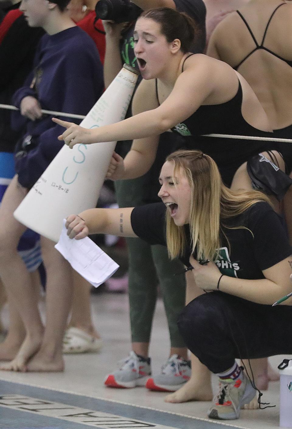 Nordonia swimmer Sophia Fiorucci, top, and assistant coach Murphy Vance cheer on their 200 yard medley relay team in the Suburban League National Conference Championships on Saturday, Jan. 7, 2023 in Akron, Ohio, at Ocasek Natatorium.