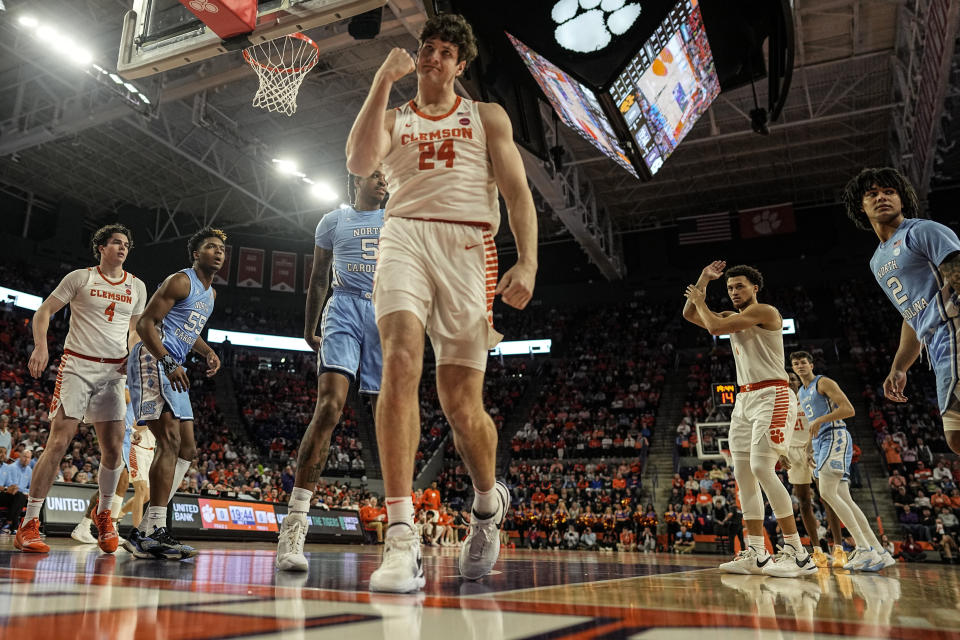 Clemson center PJ Hall (24) celebrates being fouled by North Carolina during the first half of an NCAA college basketball game, Saturday, Jan. 6, 2024, in Clemson, S.C. AP Photo/Mike Stewart)