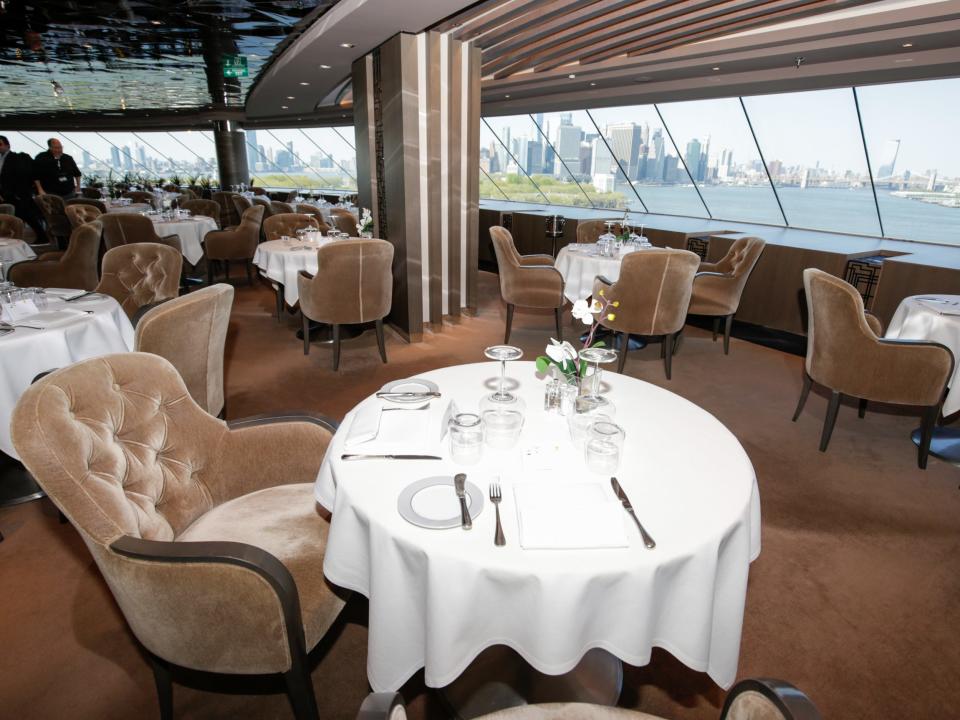 A restaurant in the MSC Meraviglia with views of NYC