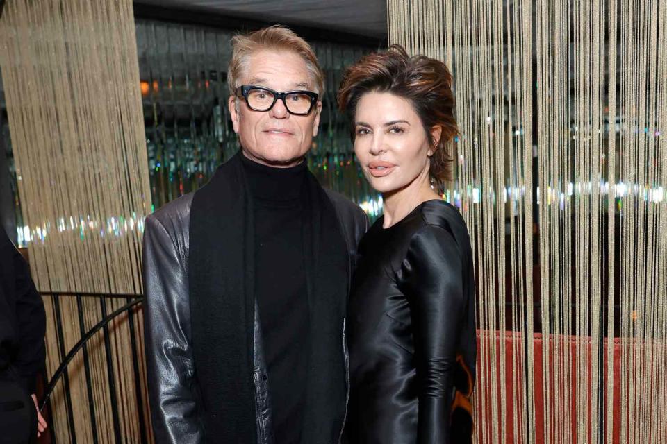 <p>Stefanie Keenan/Getty </p> (L-R) Harry Hamlin and Lisa Rinna are pictured attending the Vanity Fair and Amazon MGM Studios awards season celebration at Bar Marmont on January 06, 2024 in Los Angeles, California. 