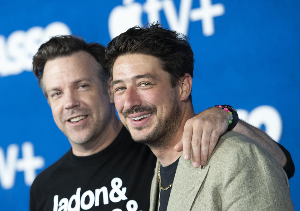 Actor Jason Sudeikis  (L) and Composer Marcus Mumford attend Apple's "Ted Lasso" season two premiere event red carpet at the Pacific Design Center, in West Hollywood, California, July 15, 2021. (Photo by VALERIE MACON / AFP) (Photo by VALERIE MACON/AFP via Getty Images)