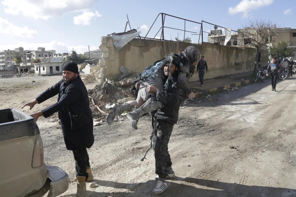 ATTENTION EDITORS - VISUAL COVERAGE OF SCENES OF DEATH AND INJURYA man carries an injured woman in a site hit by what activists said were airstrikes carried out by the Russian air force in the rebel-controlled area of Maaret al-Numan town in Idlib province, Syria January 9, 2016. At least 70 people died in what activists said where 4 vacuum bombs dropped by the Russian air force in the town of Maaret al-Numan; other air strikes were also carried out in the towns of Saraqib, Khan Sheikhoun and Maar Dabseh, in Idlib. REUTERS/Khalil Ashawi