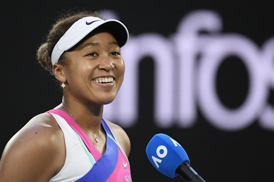 Naomi Osaka of Japan is interviewed after defeating Madison Brengle of the U.S. in their second round match at the Australian Open tennis championships in Melbourne, Australia, Wednesday, Jan. 19, 2022. (AP Photo/Andy Brownbill)