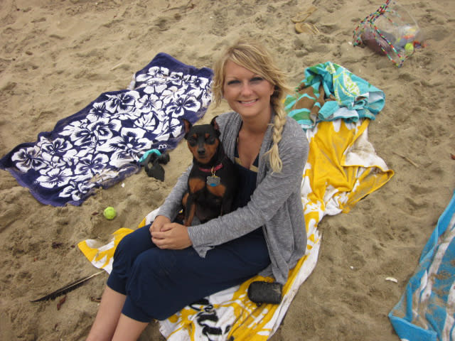 Jackie Vestal and her beloved dog, Maddox, on a beach.