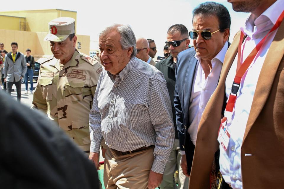 UN secretary general Antonio Guterres (C) flanked by the Egyptian Second Army chief Mohammad Abdel Rahman (L) and Egypt's health minister Khaled Abdel Ghaffar (R) (AFP via Getty)