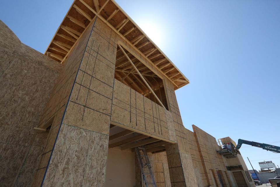 Crews work on the renovation of the old Celebrate liquor store building on West Picacho Avenue in Las Cruces on April 7, 2022. Current tenants hope to convert most of the building into a cannabis dispensary.