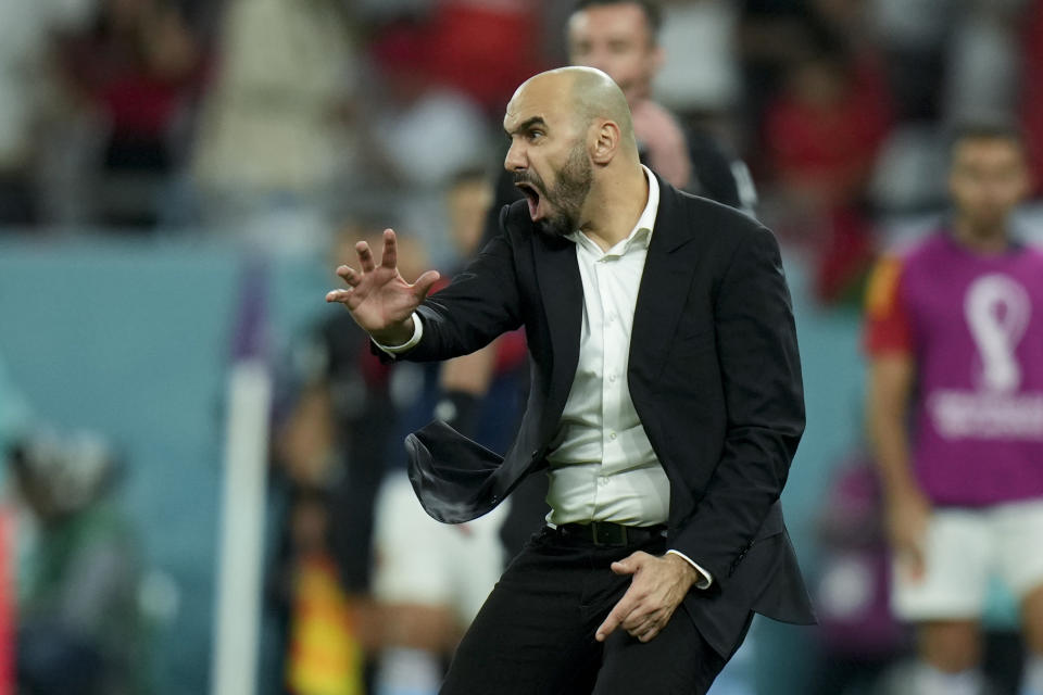 Morocco's head coach Walid Regragui react during the World Cup round of 16 soccer match between Morocco and Spain, at the Education City Stadium in Al Rayyan, Qatar, Tuesday, Dec. 6, 2022. (AP Photo/Francisco Seco)