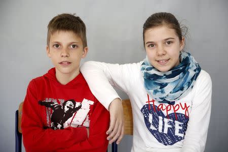 Twins Almina (R) and Almin Duranovic pose for a portrait in primary school in Buzim April 10, 2015. REUTERS/Dado Ruvic