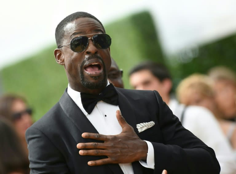 Emmy nominee and past winner Sterling K. Brown from NBC drama "This Is Us" arrives at the 70th Emmy Awards in a sleek tux and dark shades