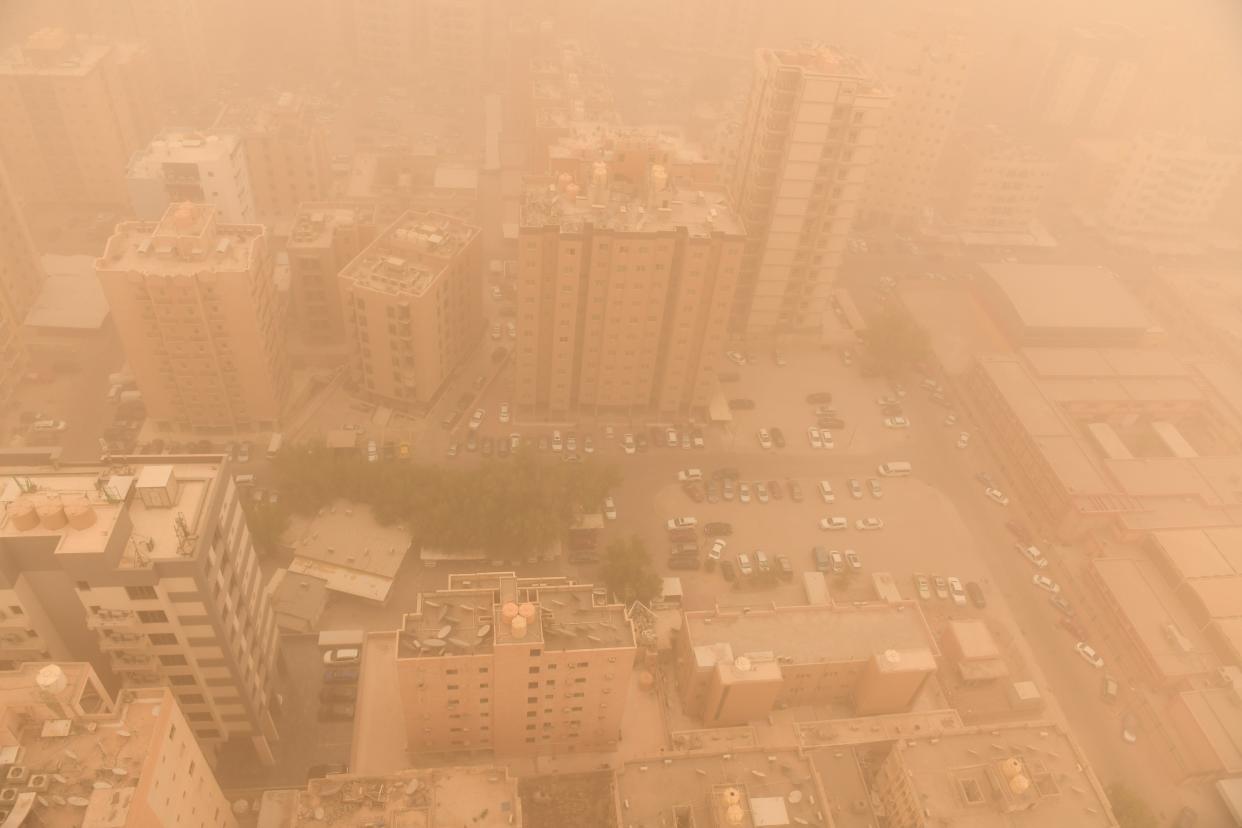 A sandstorm engulfs the city centre, in Kuwait City last week (Anadolu Agency via Getty Images)