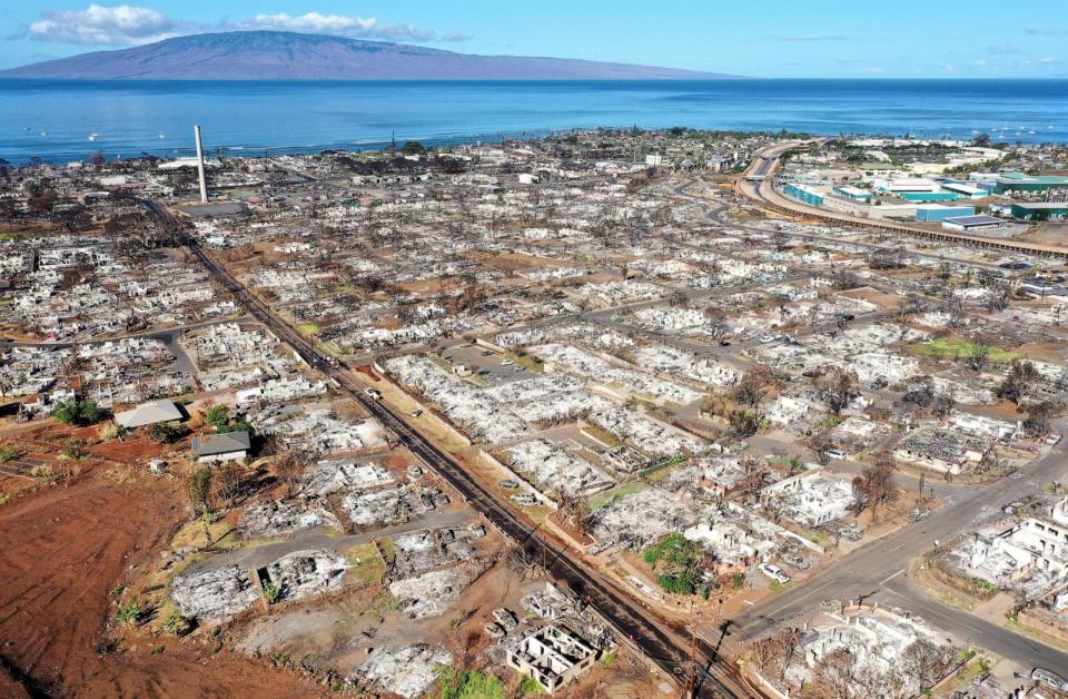 PHOTO: In an aerial view, burned structures and cars are seen nearly two months after a devastating wildfire, on Oct. 7, 2023, in Lahaina, Hawaii.  (Mario Tama/Getty Images)