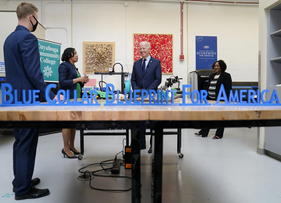 President Joe Biden smiles during a tour of the Cuyahoga Community College Manufacturing Technology Center, Thursday, May 27, 2021, in Cleveland. (AP Photo/Evan Vucci)