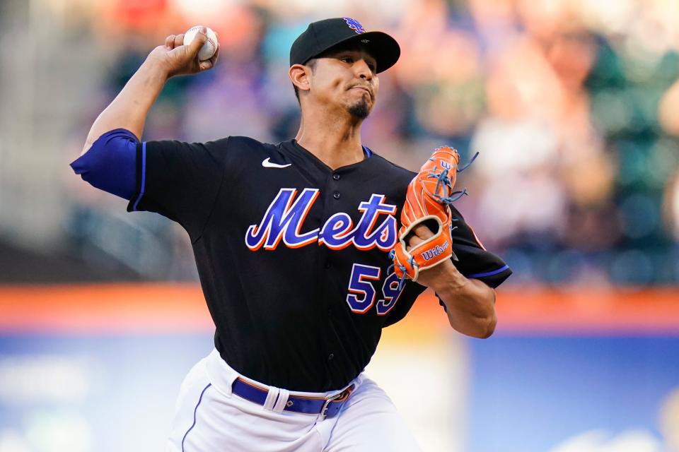 New York Mets' Carlos Carrasco pitches during the first inning of a baseball game against the Miami Marlins, Friday, June 17, 2022, in New York.