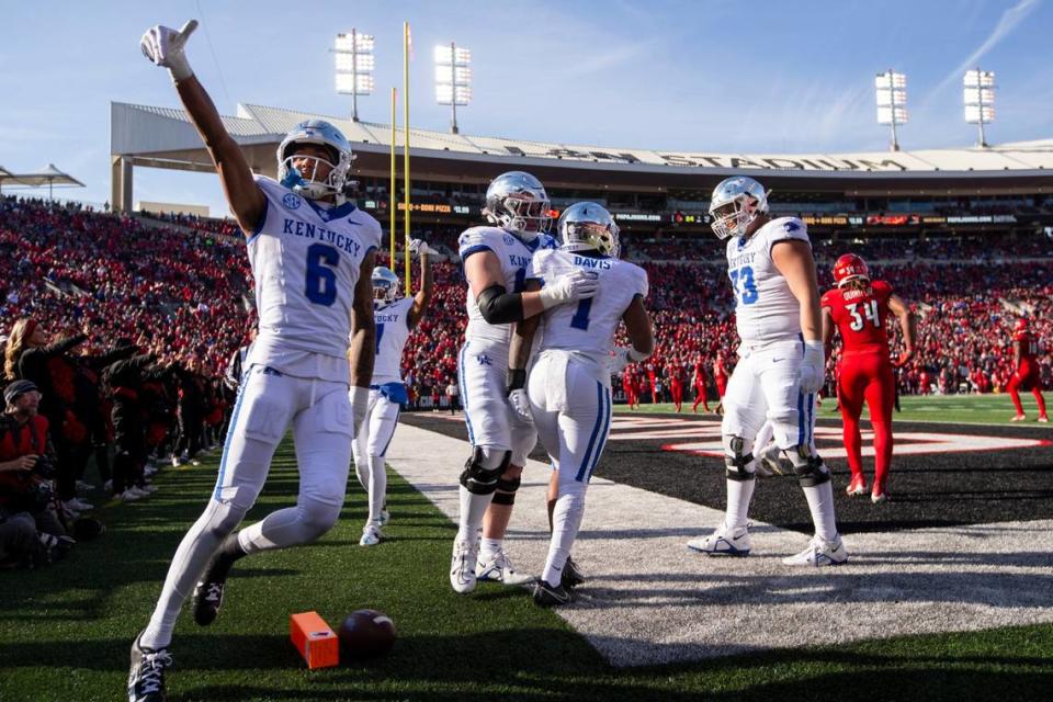 Kentucky’s Dane Key (6) and his teammates celebrate a touchdown scored by Ray Davis (1) during Saturday’s Governor’s Cup victory against Louisville at L&N Federal Credit Union Stadium.