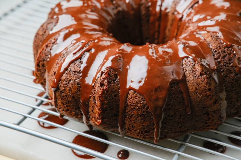 Chocolate drizzle on top of chocolate cake.