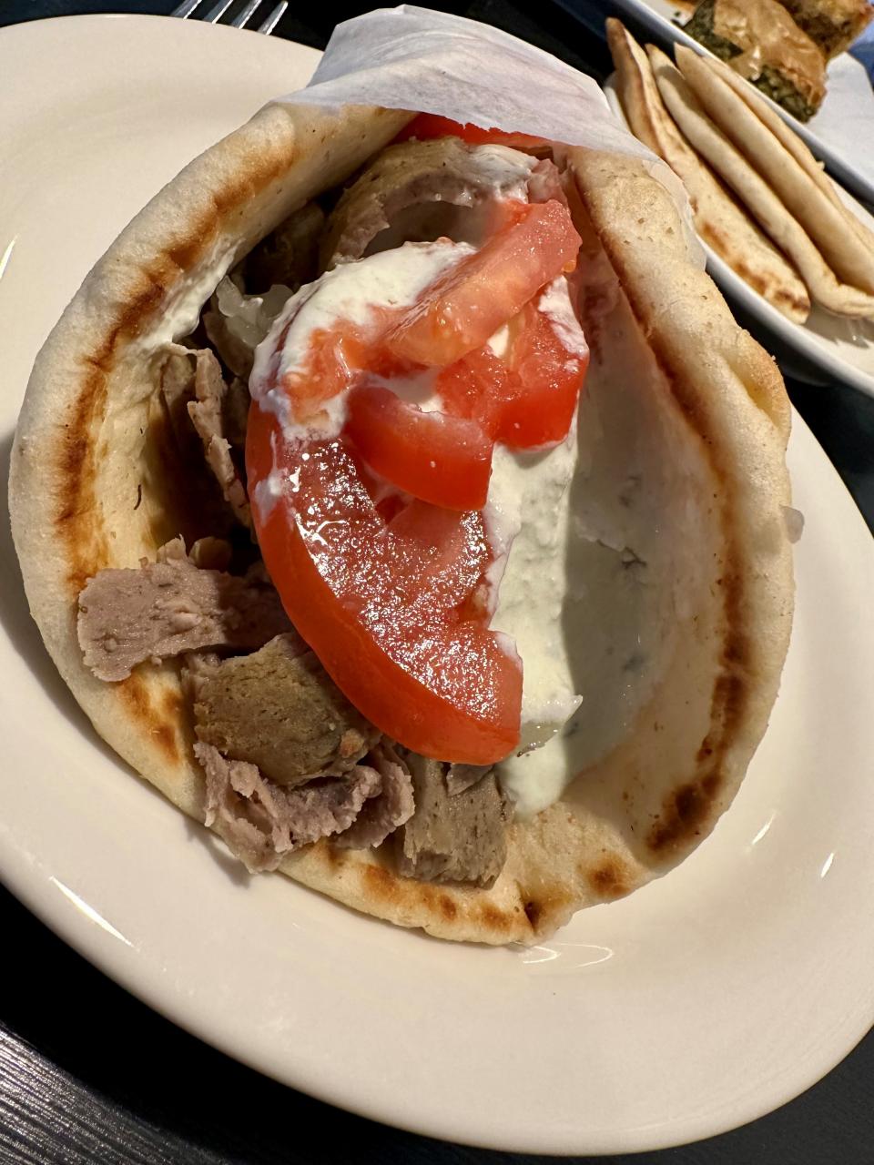 The gyro at Niki’s Rainbow Restaurant & Bar in Satellite Beach was glorious: so fat with slices of seasoned meat, tomato and onions dressed with tzatziki that you had to give up, put it down and use knife and fork.