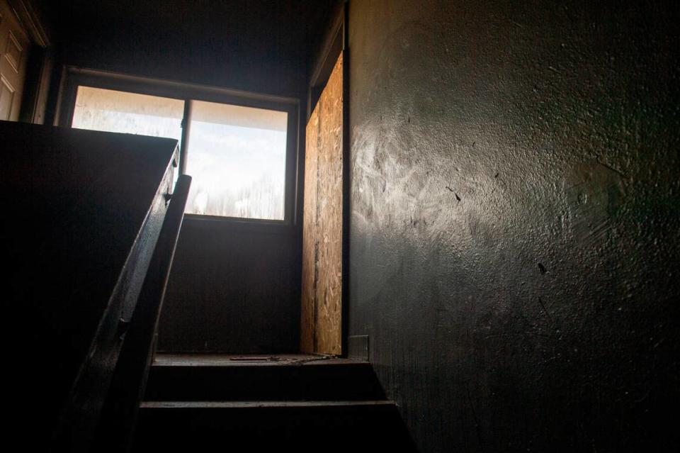 The stairwell of the I building of the William Bell Apartments in Gulfport where a fire killed two and injured 5, two of them critically, in the early hours of Wednesday, Jan. 25, 2023. The fire started in the apartment with the boarded up door and smoke damaged an adjacent apartment while the two downstairs apartments were still habitable, according to Gulfport Fire Chief Billy Kelly.