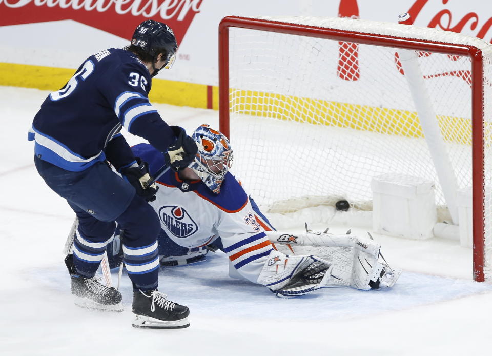 Winnipeg Jets' Morgan Barron (36) scores against Edmonton Oilers goaltender Jack Campbell (36) during second-period NHL hockey game action in Winnipeg, Manitoba, Saturday, March 4, 2023. (John Woods/The Canadian Press via AP)