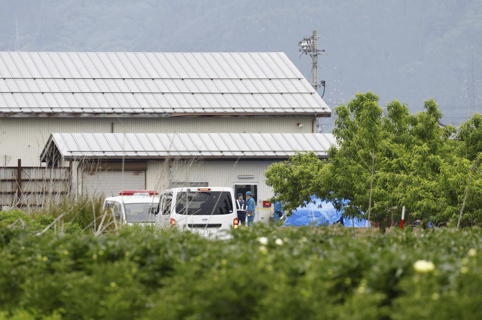 Investigators check around the site of an incident in Nakano, Nagano prefecture, central Japan Friday morning, May 26, 2023. Japanese police captured a suspect with a rifle and knife who had holed up inside a house after killing four people, including two police officers, was arrested early Friday after an hourslong standoff, according to news reports. (Kyodo News via AP)