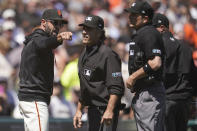San Francisco Giants manager Gabe Kapler, left, makes a point to umpire Phil Cuzzi, second from left, after being ejected during the sixth inning of the team's baseball game against the Los Angeles Dodgers in San Francisco, Thursday, Aug. 4, 2022. (AP Photo/Jeff Chiu)