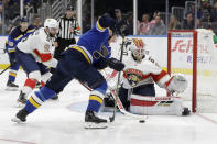 St. Louis Blues' Alexander Steen, center, is unable to score past Florida Panthers goaltender Chris Driedger, right, as Panthers' Aaron Ekblad, left, watches during the second period of an NHL hockey game Monday, March 9, 2020, in St. Louis. (AP Photo/Jeff Roberson)