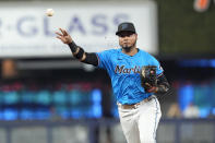 Miami Marlins second baseman Luis Arraez throws to first base for an out during the second inning of a baseball game against the Los Angeles Angels, Wednesday, April 3, 2024, in Miami. (AP Photo/Marta Lavandier)