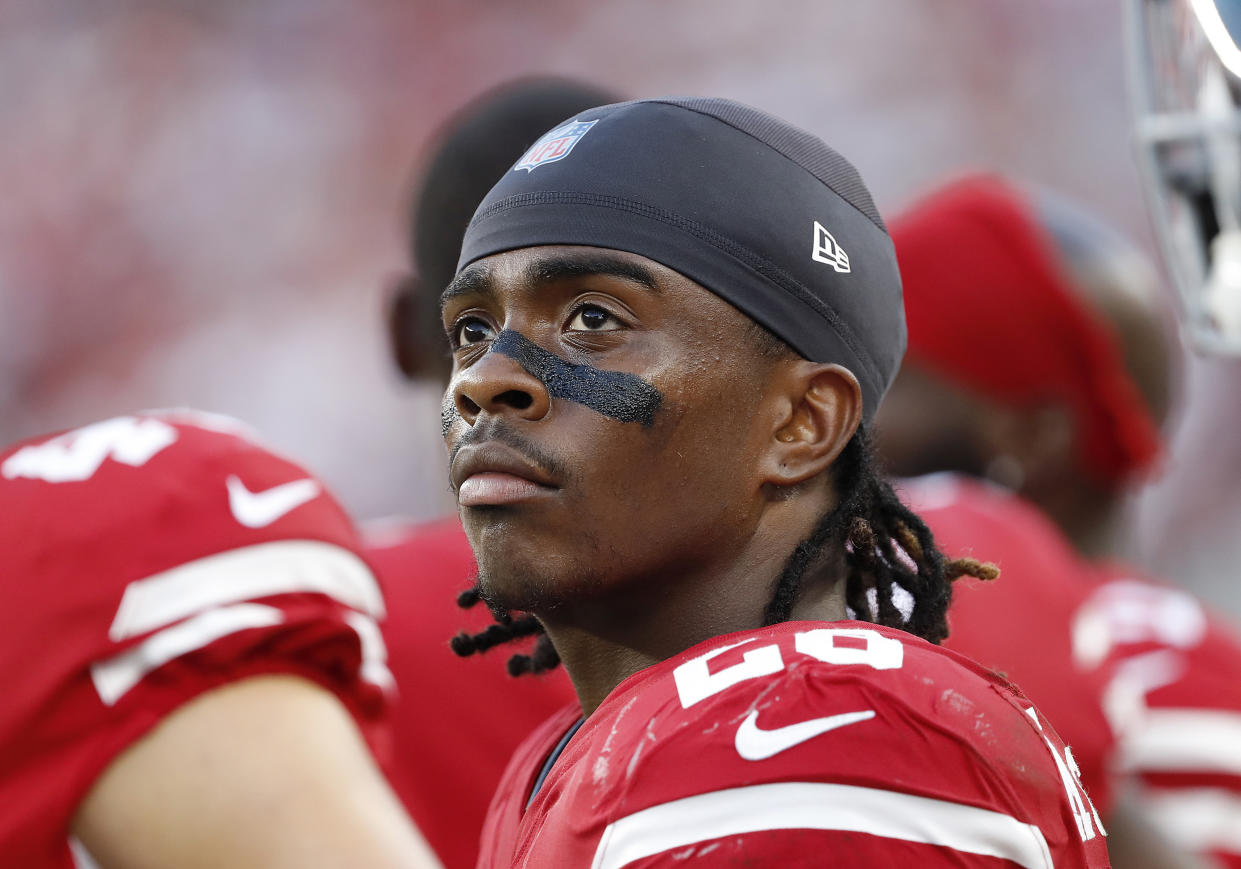 FILE - In this Aug. 9, 2018, file photo, San Francisco 49ers running back Jerick McKinnon is shown on the sideline during an NFL preseason football game against the Dallas Cowboys, in Santa Clara, Calif. McKinnon had another setback in his return from a knee injury. General manager John Lynch told flagship radio station KNBR on Wednesday , Aug. 28, 2019, that McKinnon's return to practice the previous day was "not encouraging." Lynch says McKinnon's recovery regressed for the third time this summer as he has tries to get back on the field. (AP Photo/Tony Avelar, File)