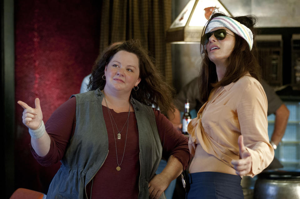 This film publicity image released by 20th Century Fox shows Sandra Bullock as FBI Special Agent Sarah Ashburn, right, and Melissa McCarthy as Boston Detective Shannon Mullins in a scene from "The Heat." (AP Photo/20th Century Fox, Gemma La Mana)