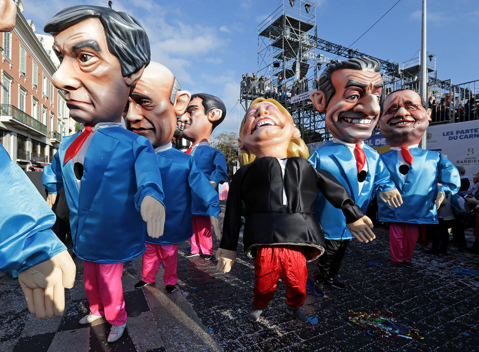 <p>Fugures of former French Prim Minister Francois Fillon (L), member of The Republicans political party and 2017 presidential candidate of the French centre-right, French National Front leader Marine Le Pen (C) and former French President Nicolas Sarkozy (R) are paraded through the crowd during the Carnival parade of the 133rd carnival, the first major event since the city was attacked during Bastille Day celebrations last year in Nice, France, Feb. 19, 2017. (Photo: Eric Gaillard/Reuters) </p>