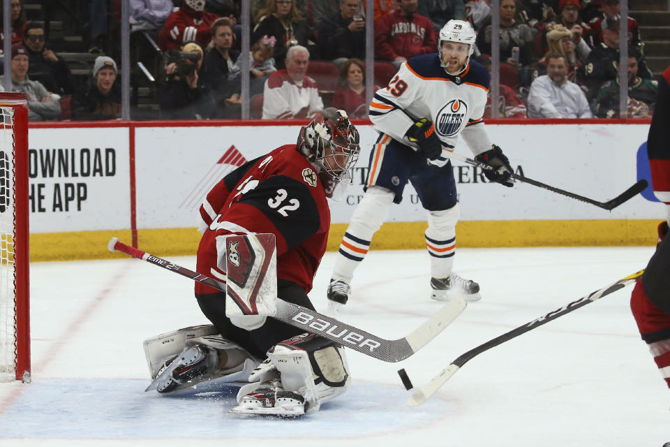 Arizona Coyotes goaltender Antti Raanta (32) makes a save on a shot from Edmonton Oilers center Leon Draisaitl (29) during the second period of an NHL hockey game Tuesday, Feb. 4, 2020, in Glendale, Ariz. The Coyotes won 3-0. (AP Photo/Ross D. Franklin)