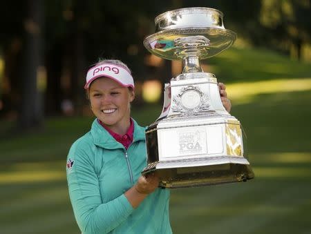 Jun 12, 2016; Sammamish, WA, USA; Brooke Henderson holds the KPMG Women's PGA Championship Trophy after winning in a play off following the final round at Sahalee Country Club - South/North Course. Joe Nicholson-USA TODAY Sports