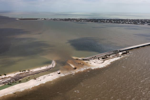 In this aerial view, parts of Sanibel Causeway are washed away along with sections of the bridge after Hurricane Ian passed through the area on Sept. 29 in Sanibel, Florida. (Photo: Joe Raedle via Getty Images)