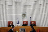Judge Neal Hendel (R), vice president of the Supreme court, Judge Elyakim Rubinstein (C) and Judge Hanan Meltzer (L) are seen during a court session regarding the case of a hunger-striking Palestinian detainee, at the Supreme court in Jerusalem, August 19, 2015. REUTERS/Ronen Zvulun