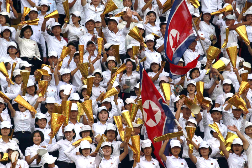 North Korea's fans celebrate during the World Cup Group H qualifying soccer match between North Korea and Lebanon at the Kim Il Sung Stadium in Pyongyang, Thursday, Sept. 5, 2019. North Korea won the game 2-0. (AP Photo/Jon Chol Jin)