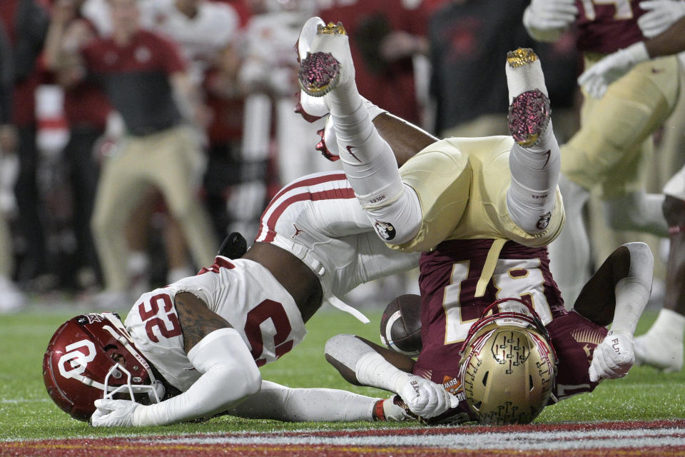 Oklahoma defensive back Justin Broiles (25) breaks up a pass intended for Florida State tight end Camren McDonald (87) during the first half of the Cheez-It Bowl NCAA college football game Thursday, Dec. 29, 2022, in Orlando, Fla. (AP Photo/Phelan M. Ebenhack)