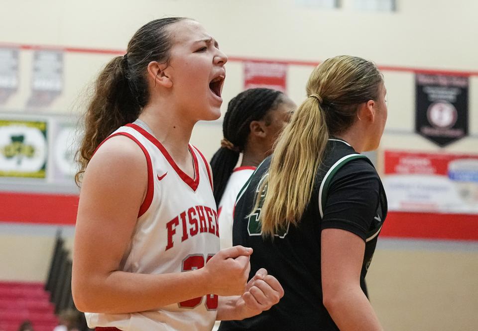 Fishers Tigers Allison Scheu (33) yells in excitement Tuesday, Nov. 21, 2023, during the game at Fishers High School in Fishers. The Fishers Tigers defeated the Zionsville Eagles, 46-38.