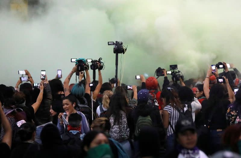 People take part in a protest against gender-based violence in downtown of Mexico City