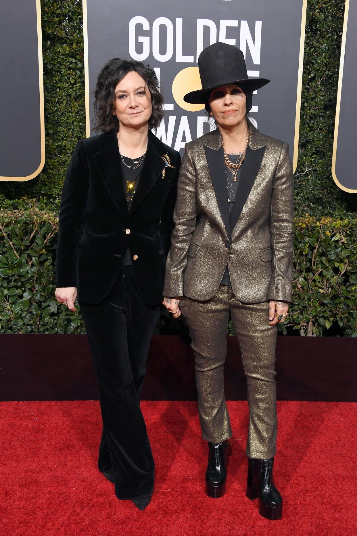 Sara Gilbert (left) and Linda Perry (right) pose on red carpet