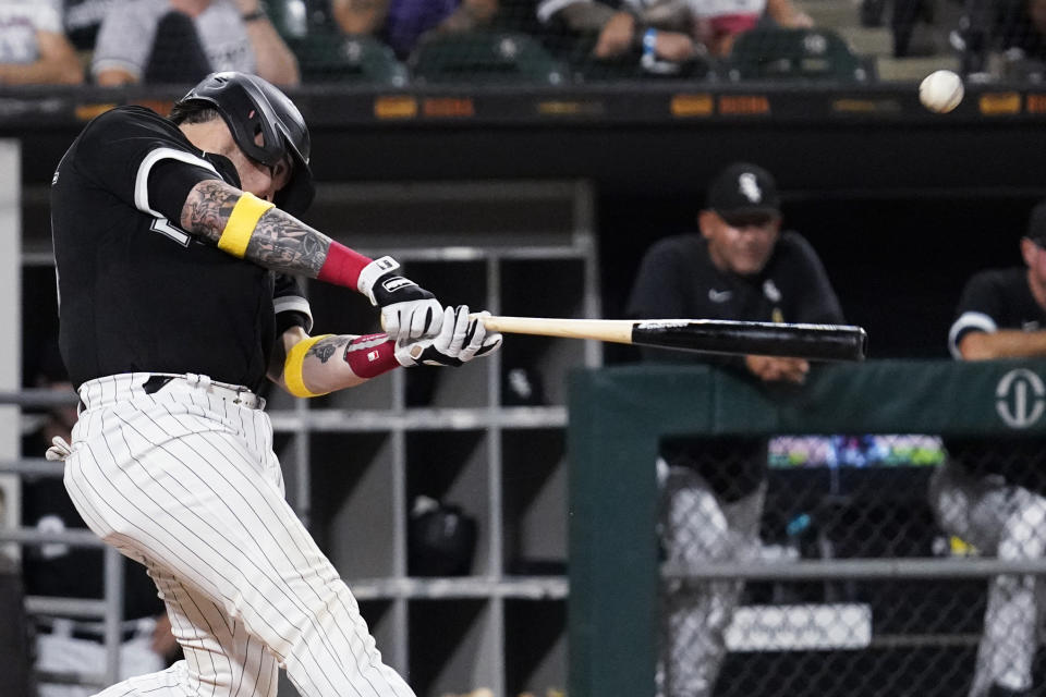 Chicago White Sox's Yasmani Grandal hits a one-run single against the Minnesota Twins during the fourth inning of a baseball game in Chicago, Friday, Sept. 2, 2022. (AP Photo/Nam Y. Huh)