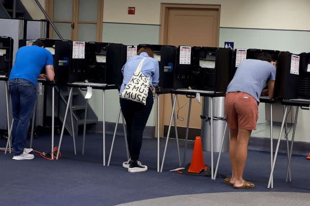 PHOTO: Voters cast their ballots at a polling station on Nov. 8, 2022, in Miami, Fla. (Joe Raedle/Getty Images)