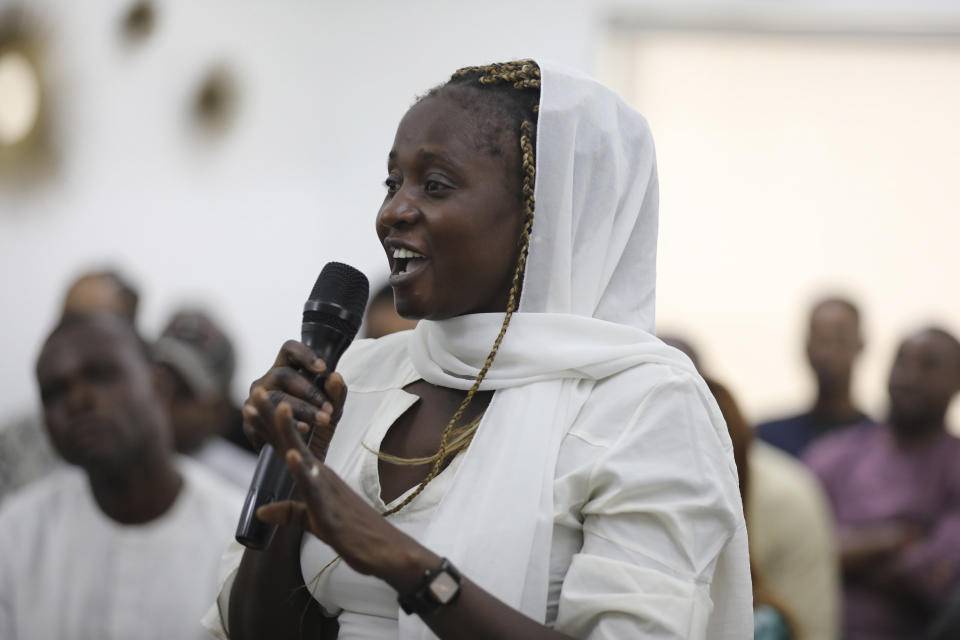 Esther Nkeki, whose sister Mary Nkeki, one of the Chibok schoolgirls who was kidnapped in 2014 by Islamic extremists and later released, a 10th anniversary event of the abduction in Lagos, Nigeria, Thursday, April 4, 2024. A new film in Nigeria is being screened to remember the nearly 100 schoolgirls who are still in captivity 10 years after they were seized from their school in the country’s northeast. At least 276 girls were kidnapped during the April 2014 attack, but most have since regained their freedom. (AP Photo/Mansur Ibrahim )