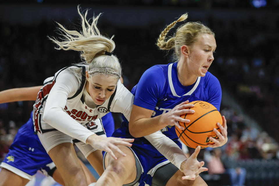 South Dakota State guard Ellie Colbeck, right, beats South Carolina forward Chloe Kitts, left, to the ball during the first half of an NCAA college basketball game in Columbia, S.C., Monday, Nov. 20, 2023. (AP Photo/Nell Redmond)