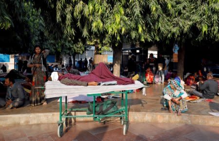 FILE PHOTO: Patients and their attendants wait outside the Out Patient Department (OPD) at a government-run hospital in New Delhi, India, November 22, 2017. REUTERS/Saumya Khandelwal/File photo