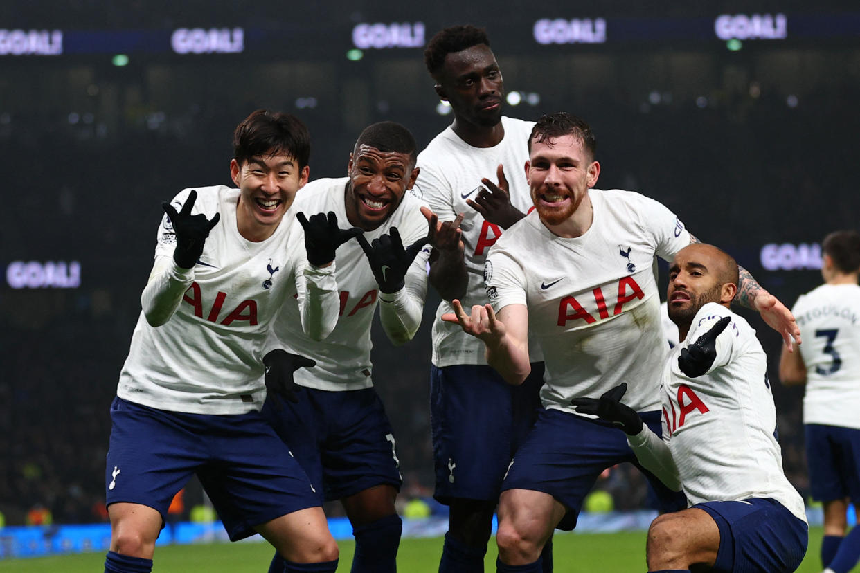 Tottenham Hotspur's South Korean striker Son Heung-Min (left) celebrates with teammates after scoring their third goal during their English Premier League football match against Crystal Palace.