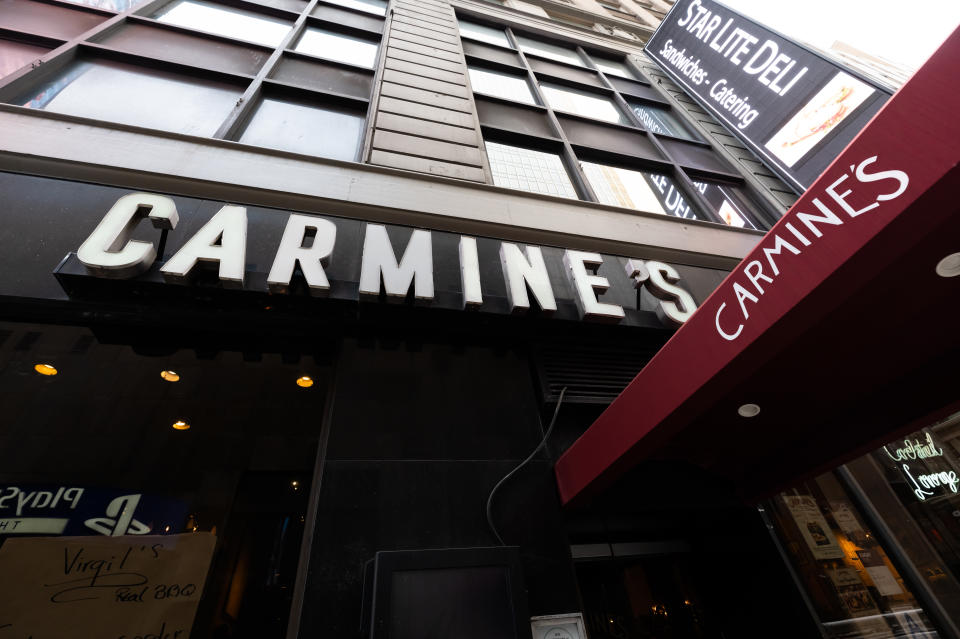 NEW YORK, NEW YORK - DECEMBER 23: A view outside Carmine's in Times Square on December 23, 2020 in New York City. The pandemic continues to burden restaurants and bars as businesses struggle to thrive with evolving government restrictions and social distancing plans which impact keeping businesses open yet challenge profitability. (Photo by Noam Galai/Getty Images)