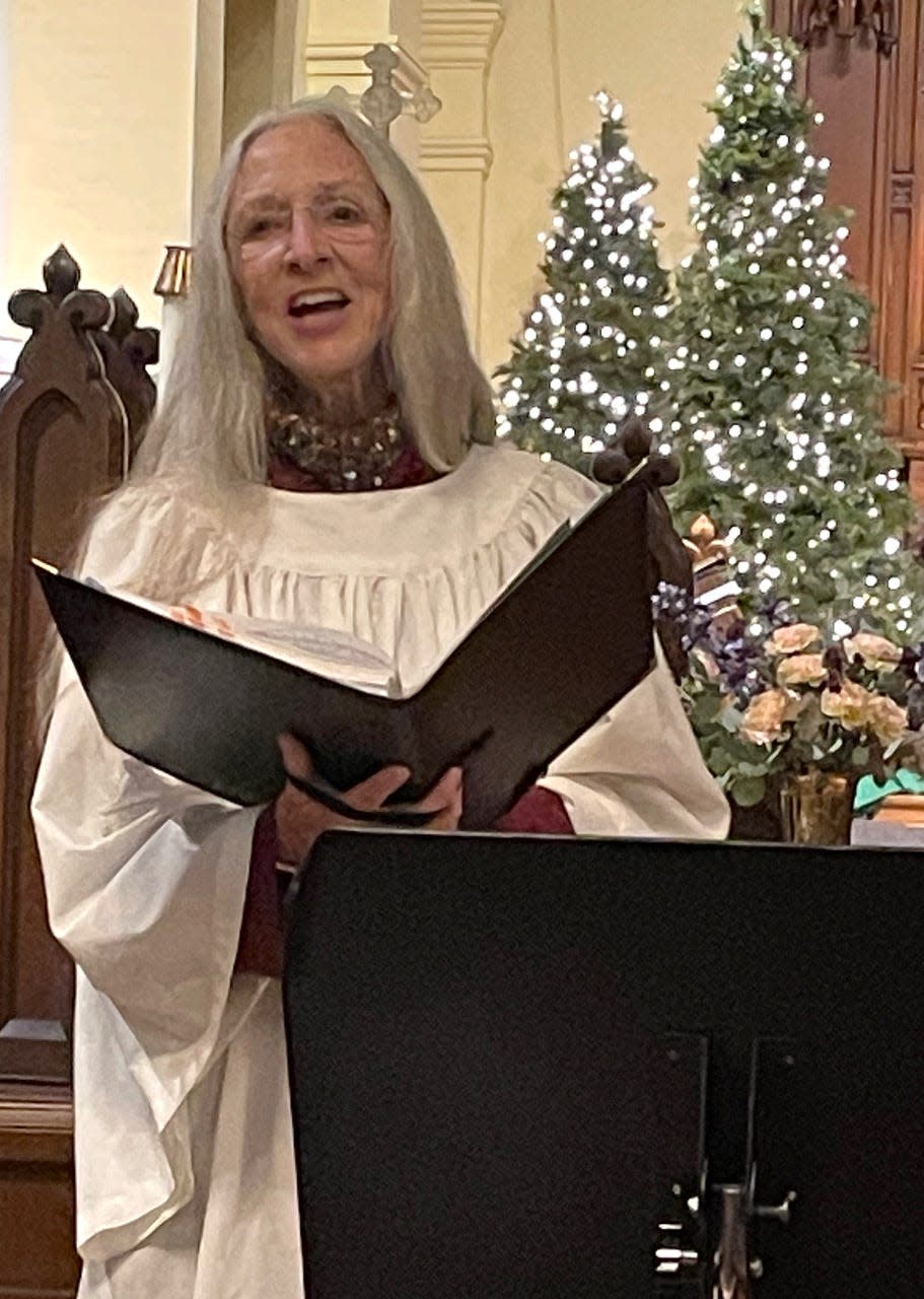 Nancy Baker Cazan performs at St. Timothy’s Church during the 2022 Candlelight Walk in downtown Massillon. This year's self-guided tour throughout the city's churches and other locations is Sunday.