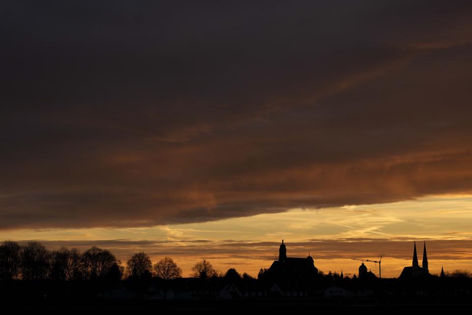 The St. Anna basilica is silhouetted by the rising sun in Altoetting near Marktl, the birthplace of of Pope emeritus Benedict XVI, Germany, Thursday, Dec. 29, 2022. The health of Pope Emeritus Benedict XVI has worsened due to his age, and doctors are constantly monitoring the 95-year-old's condition, the Vatican said Wednesday.(AP Photo/Matthias Schrader)