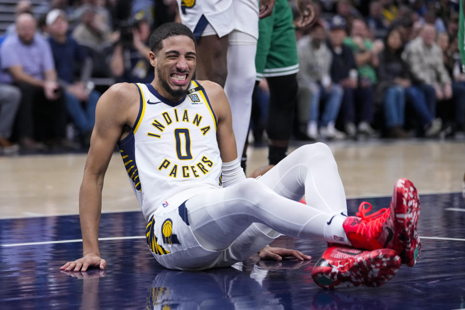 Indiana Pacers guard Tyrese Haliburton (0) reacts after being injured during the first half of an NBA basketball game against the Boston Celtics in Indianapolis, Monday, Jan. 8, 2024. (AP Photo/Michael Conroy)