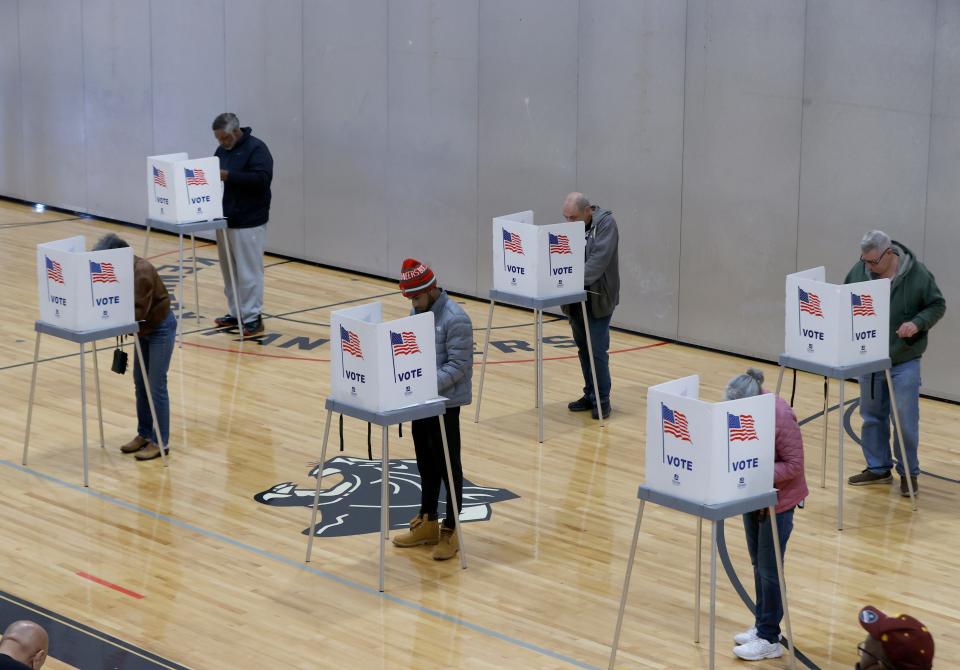 Voters cast their ballots at precincts nine and ten inside the gymnasium at Kennedy Elementary School in Pontiac on Election Day on Tuesday, Nov 8, 2022.