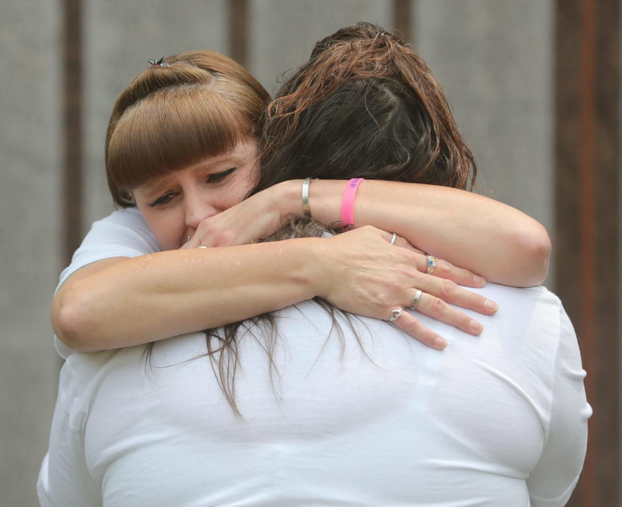 Kim Dudley, left, hugs Becky Woods after an interview interview outside the Summit County Courthouse Wednesday in which they shared memories of their best friend Lisbeth Dayton who was killed in a May 2022 wrong-way crash on Interstate 76. Jessica Skinner pleaded guilty to aggravated vehicular homicide related to the crash Wednesday. She will be sentenced Oct. 11.